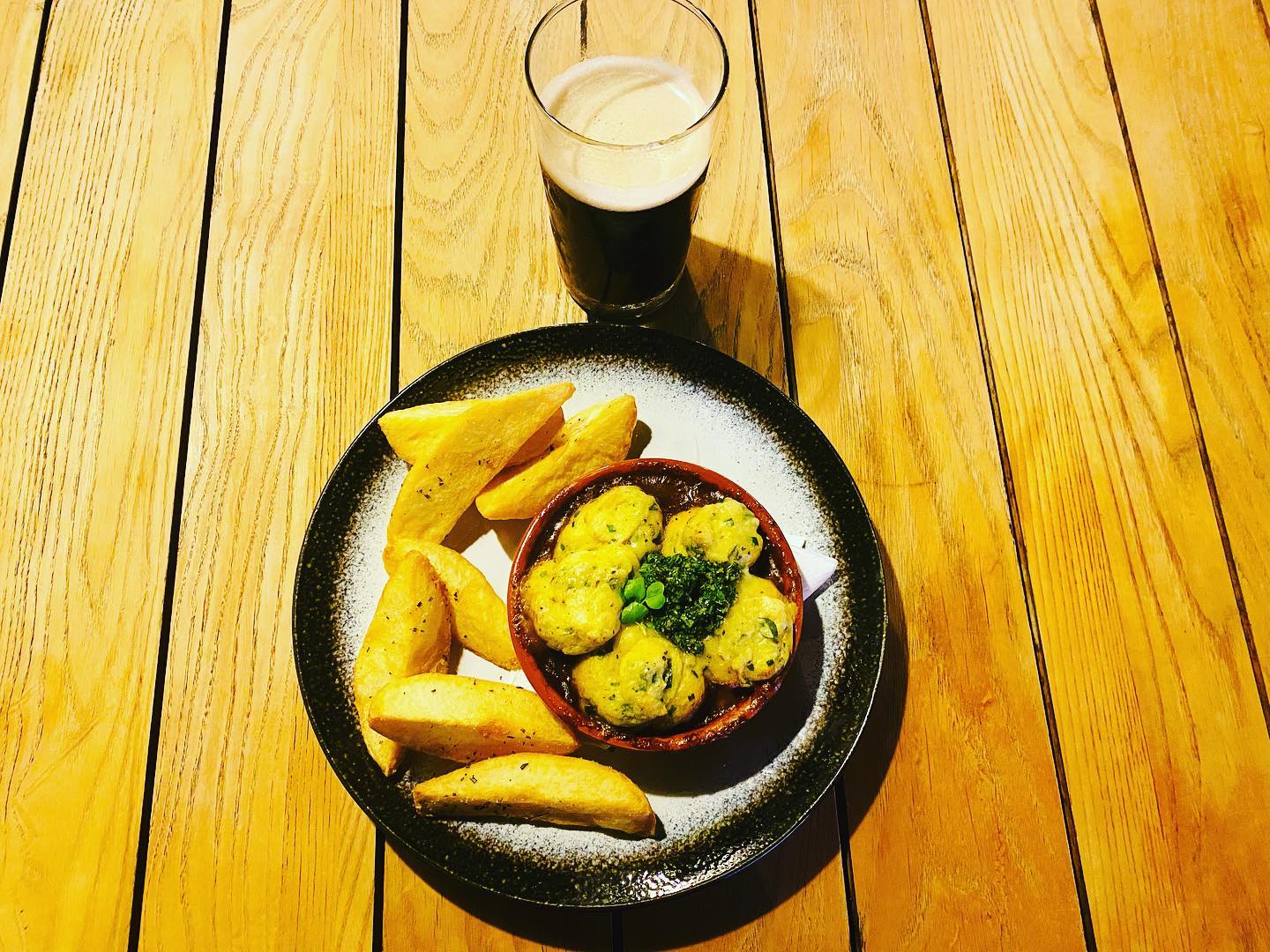 Ulster Cottage Pie (beef and Guinness pie topped with champ mash, gremolata served with house cut taties);