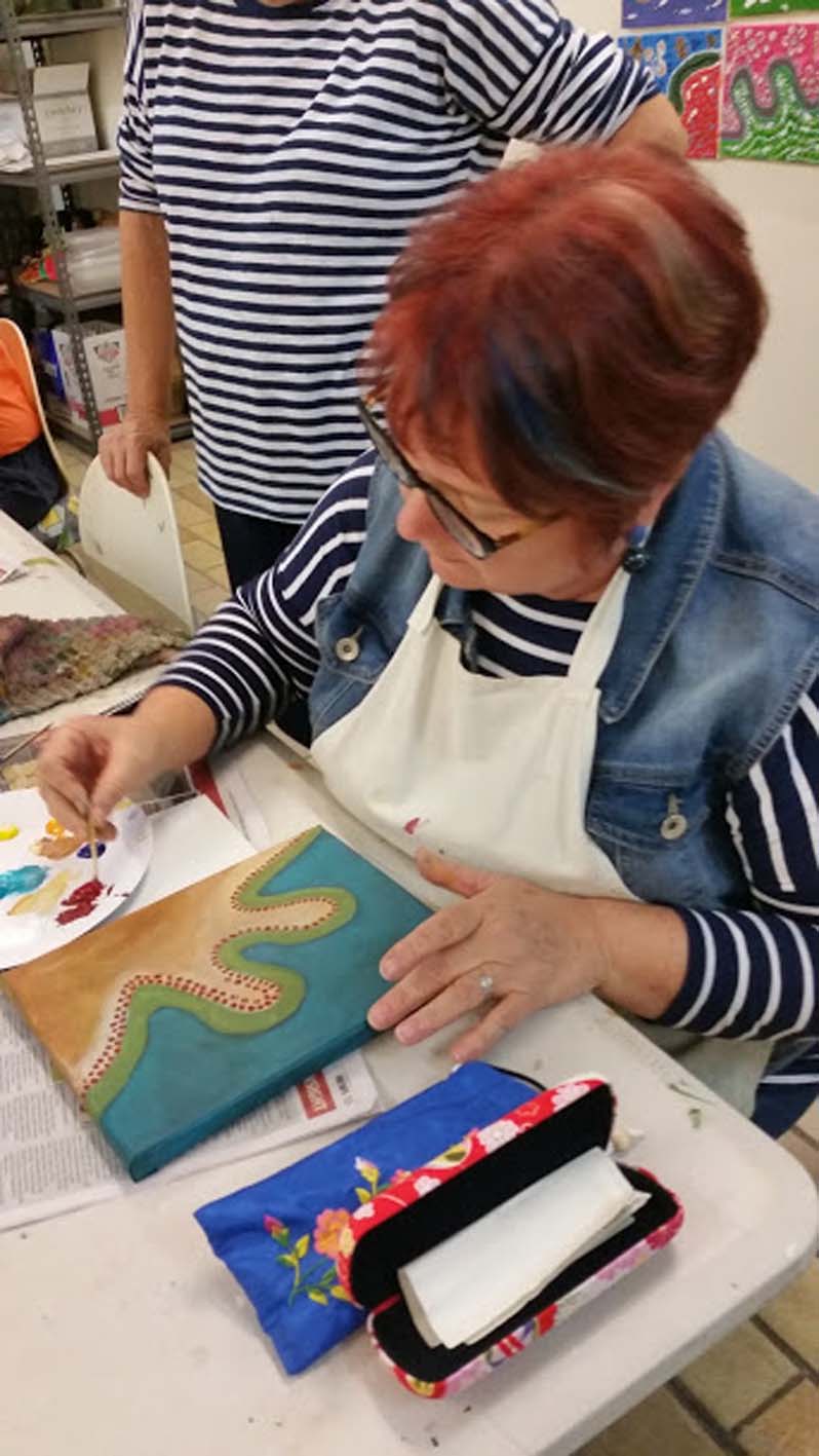 A student working in an Arts Alive Indigenous art workshop