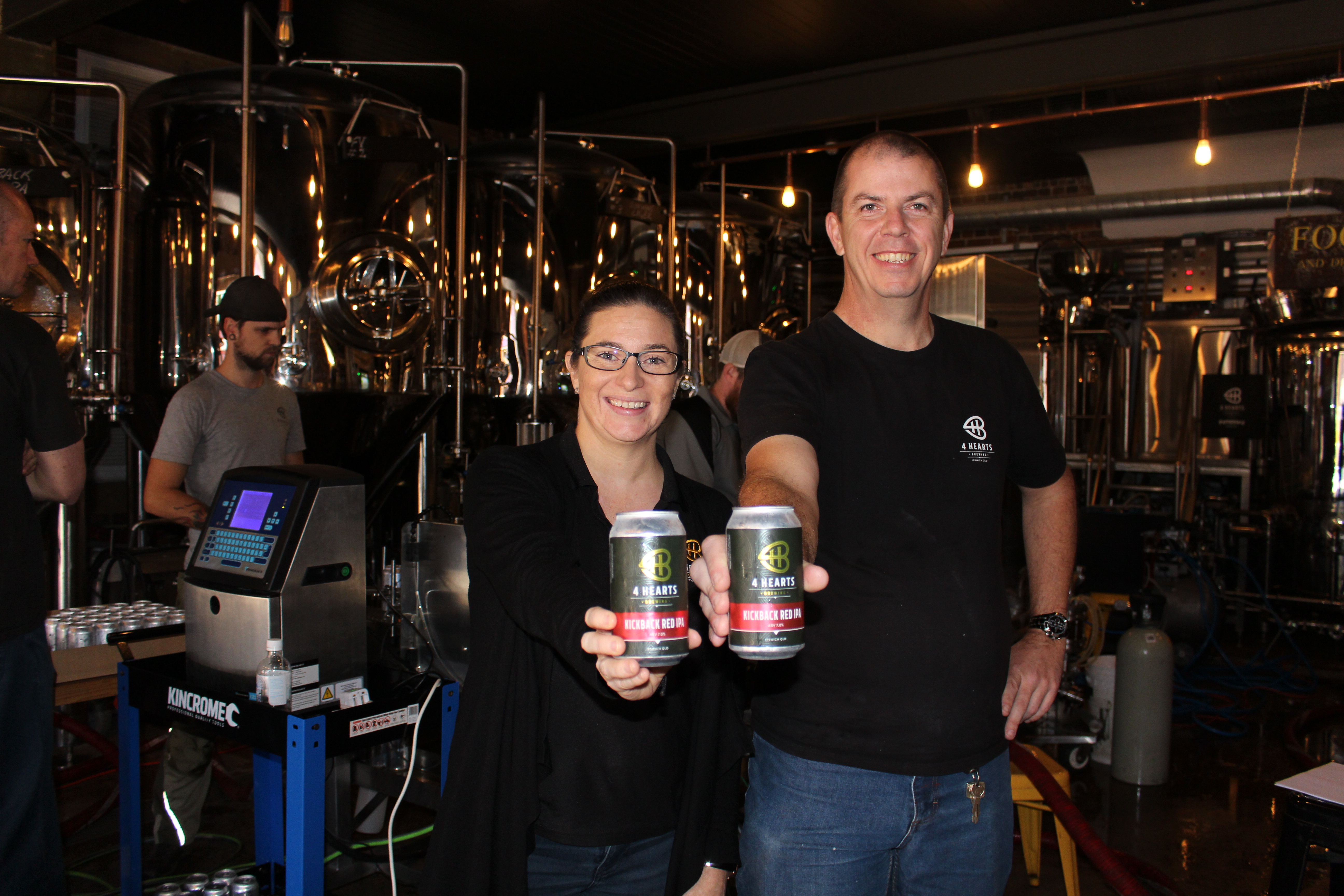 Carly Lindholm and Ken Friend with the new cans
