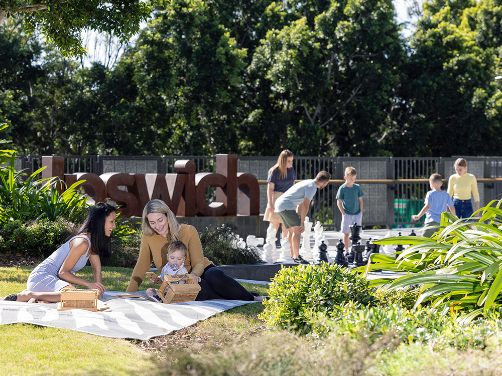 Family picnicking in Ipswich Central's Tulmur Place.
