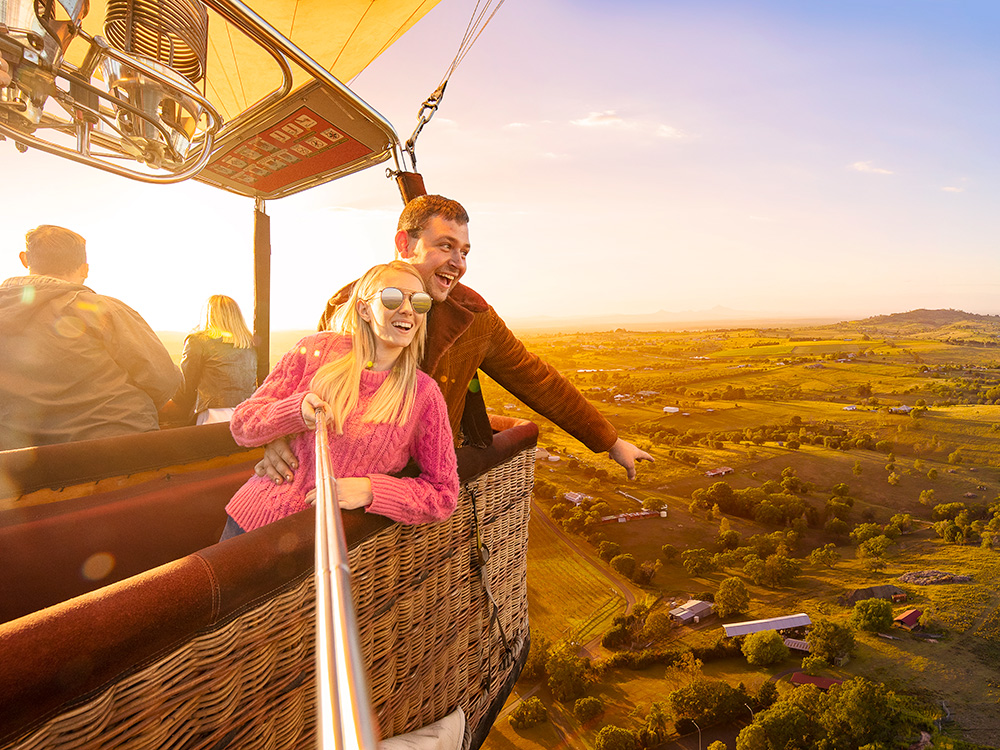 Couple enjoying a Floating Images hot air balloon flight over the City of Ipswich and surrounding areas.