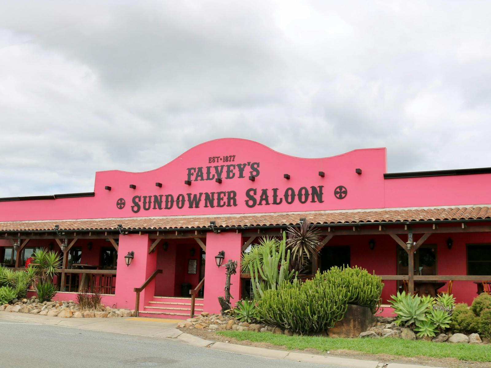 Pink Saloon with plants out the front Pink Saloon with plants out the front