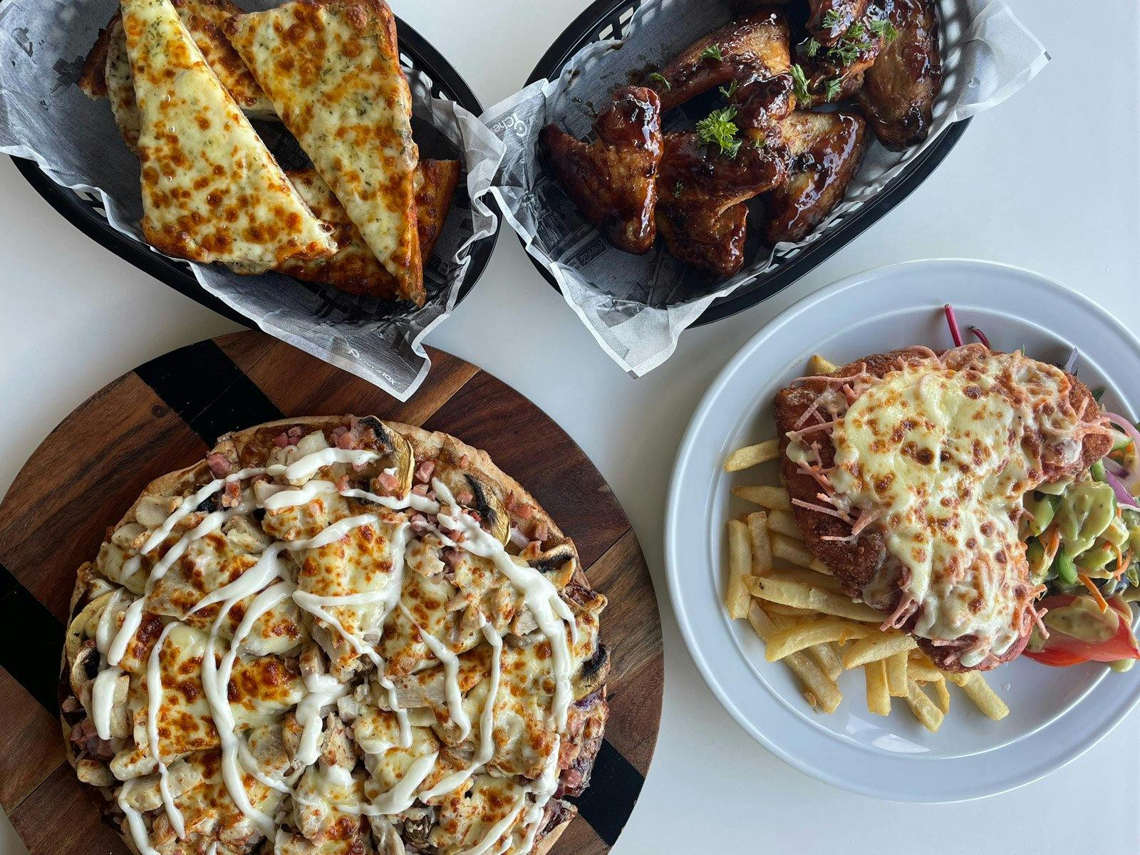 Pizza, wings, garlic bread & schnitzel - Grandchester Hotel Pizza, wings, garlic bread & schnitzel - Grandchester Hotel