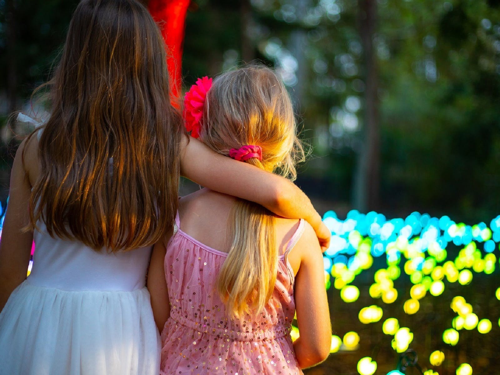 Two little girls looking at the Christmas lights