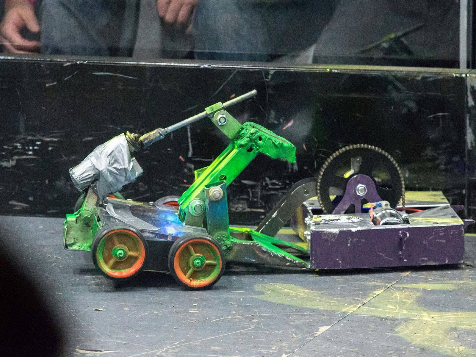 Two small wheeled robots clash